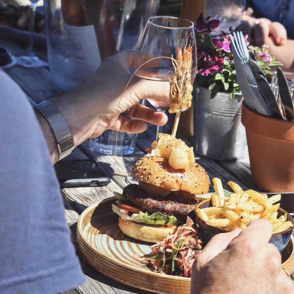 A surf n turf burger with fries
