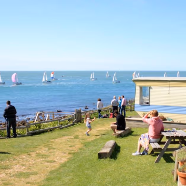 View from a caravan park to a yacht race on the sea