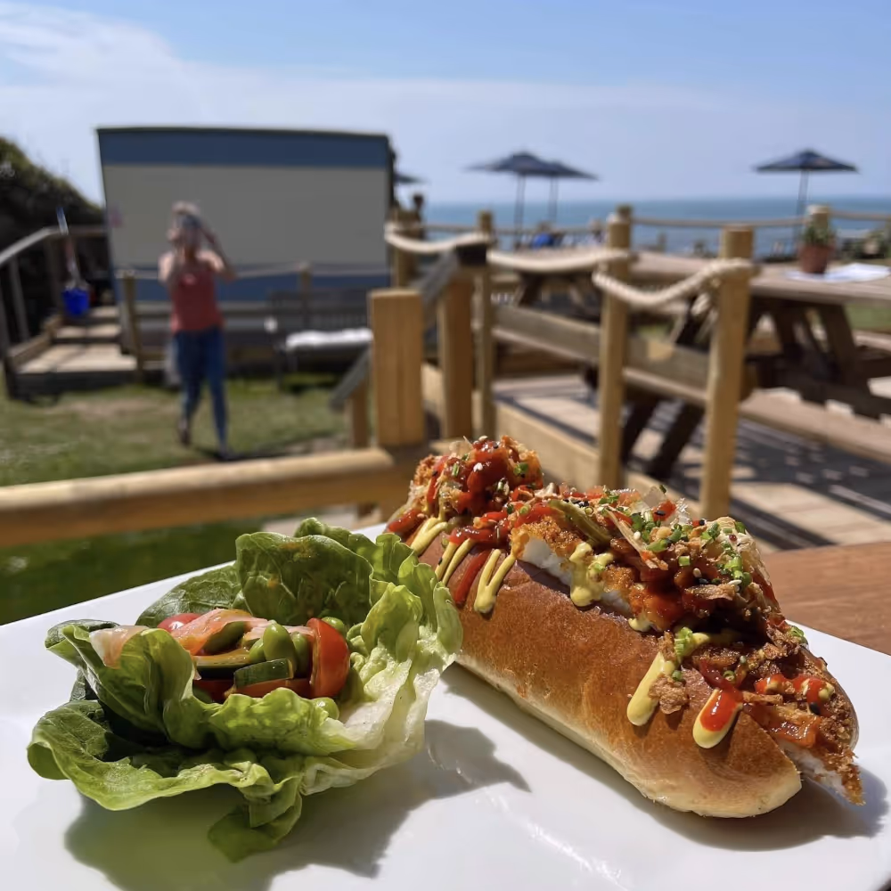 Food being served at a coastal outdoor cafe