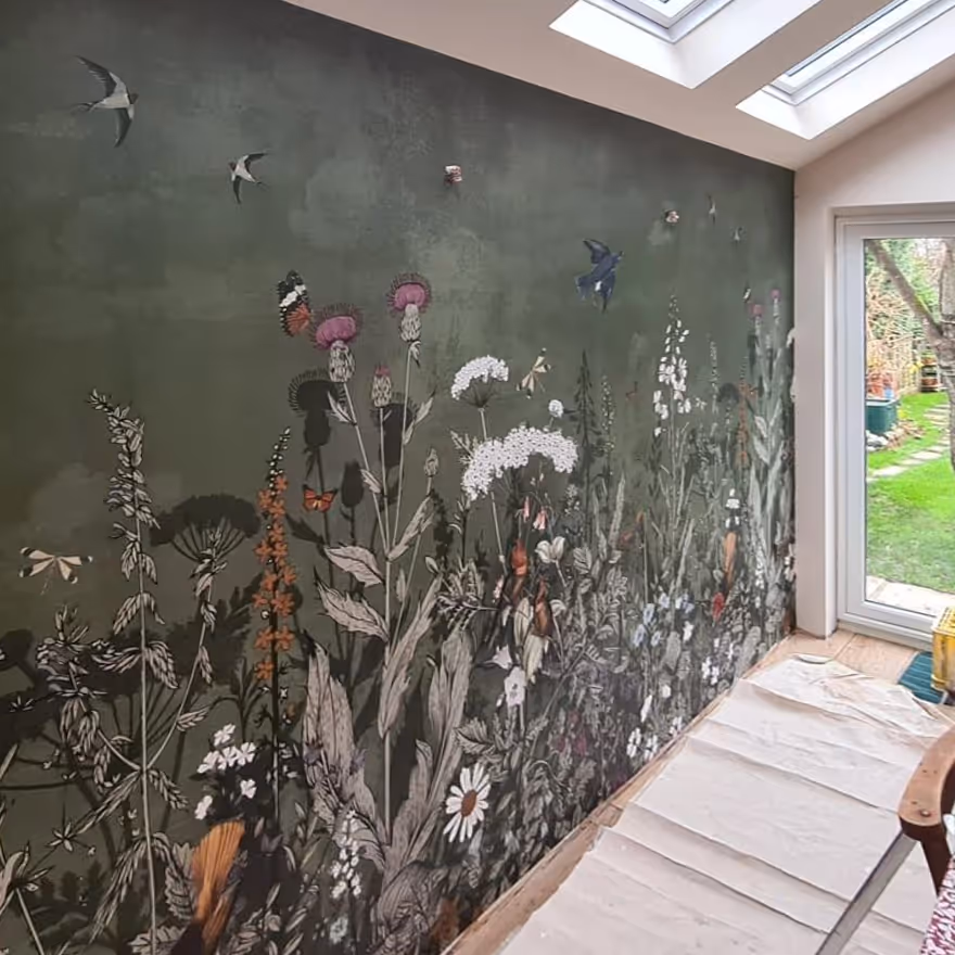 A large wall mural with a botanical theme