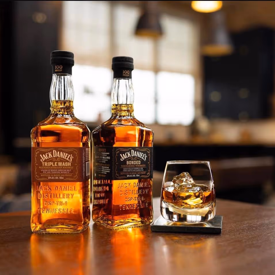 A bottles and a glass of bourbon