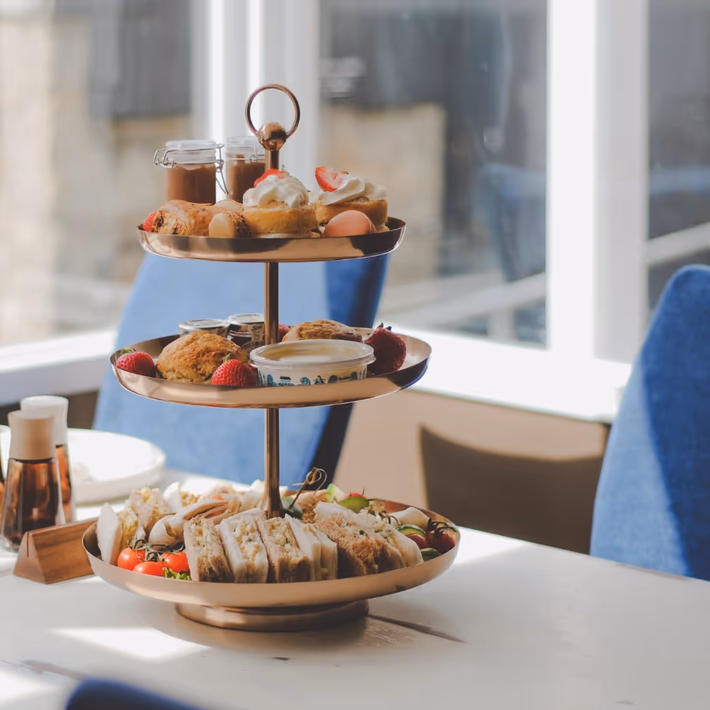 A tiered cake stand with yummy sweet treats