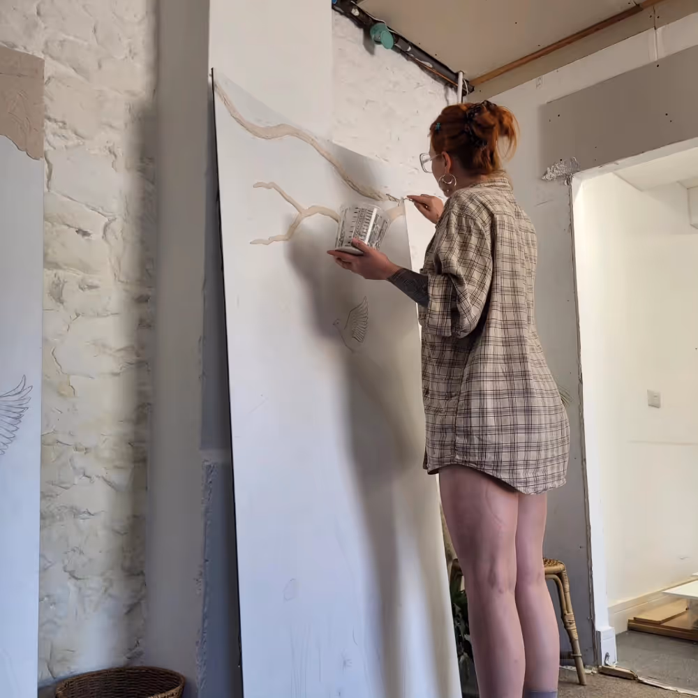 A plaster relief artist at work