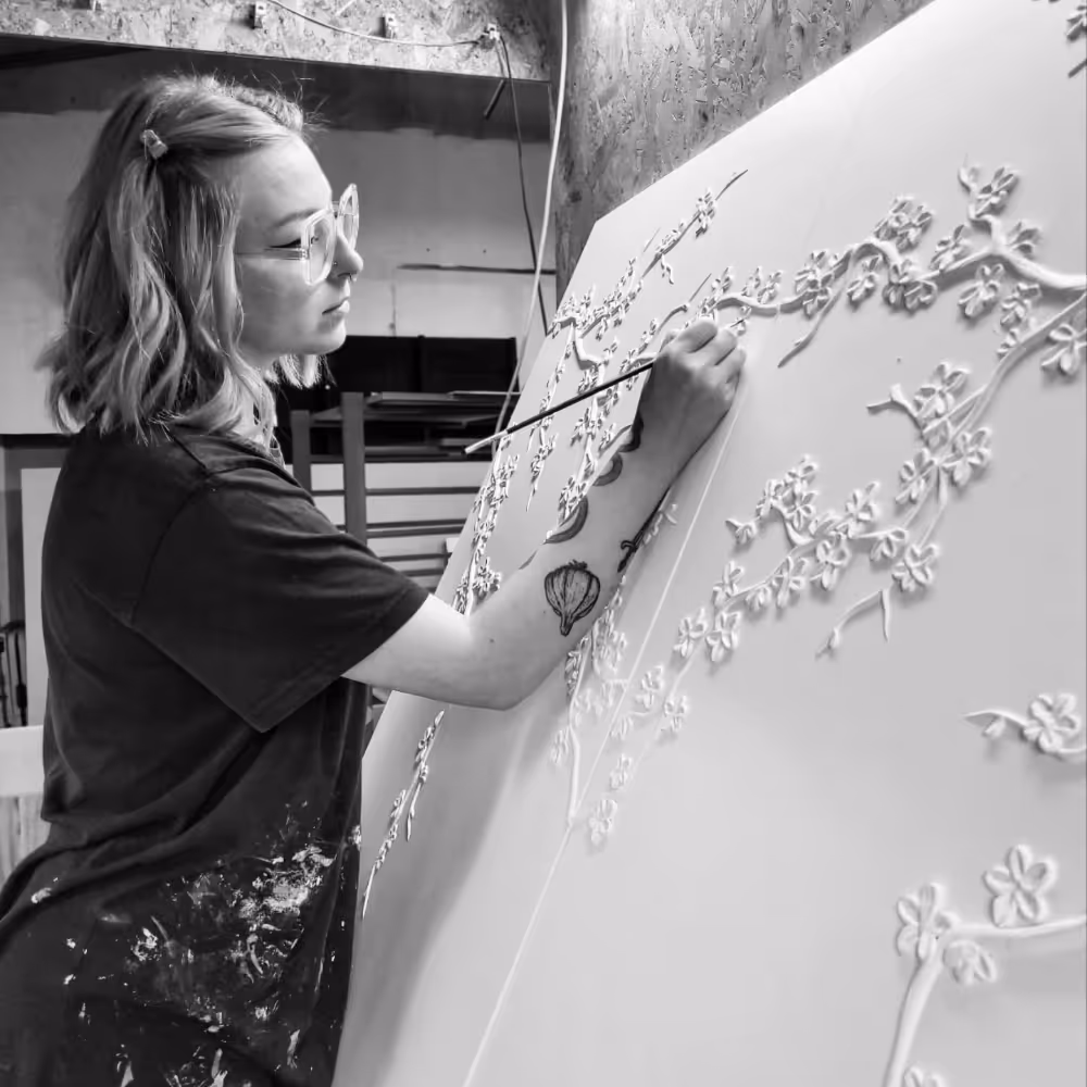 A plaster relief artist at work