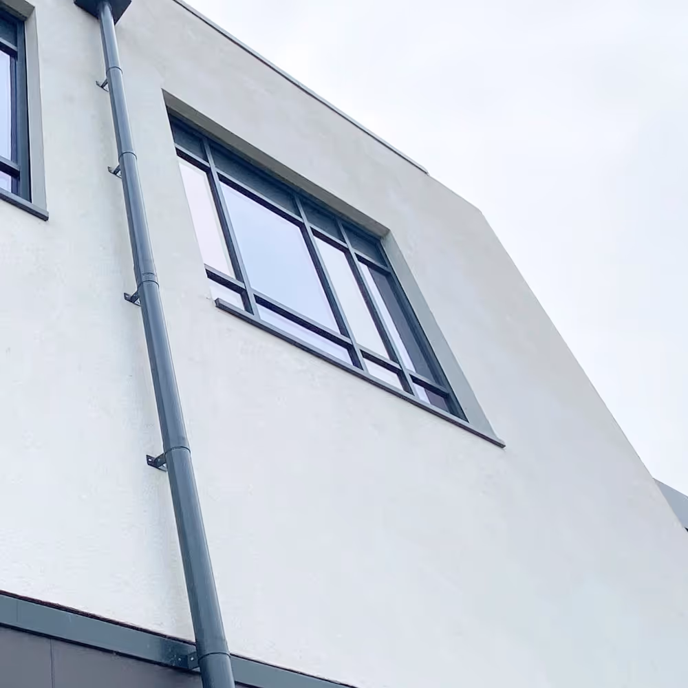 Newly cleaned render on a building