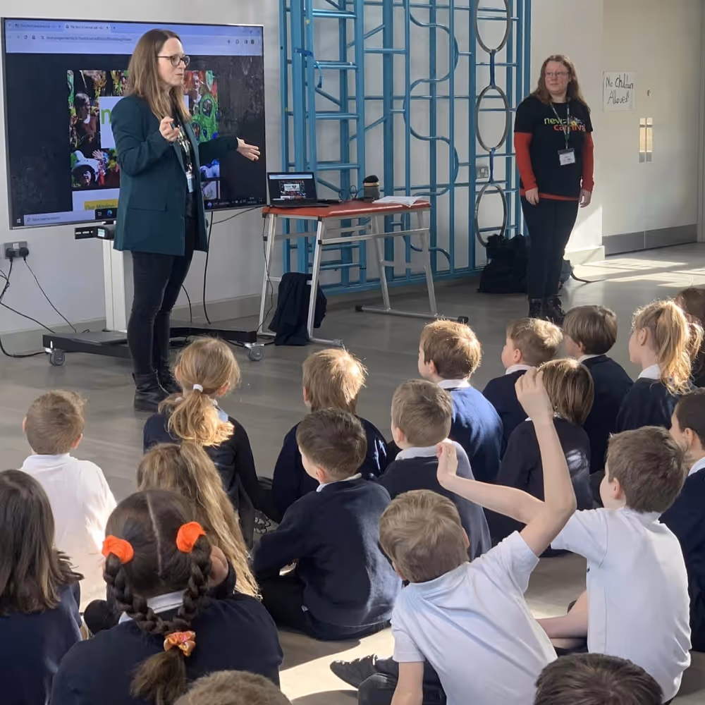 Teachers speaker to a class of kids