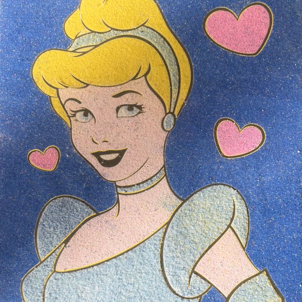 Sand art picture of a girl with blond hair