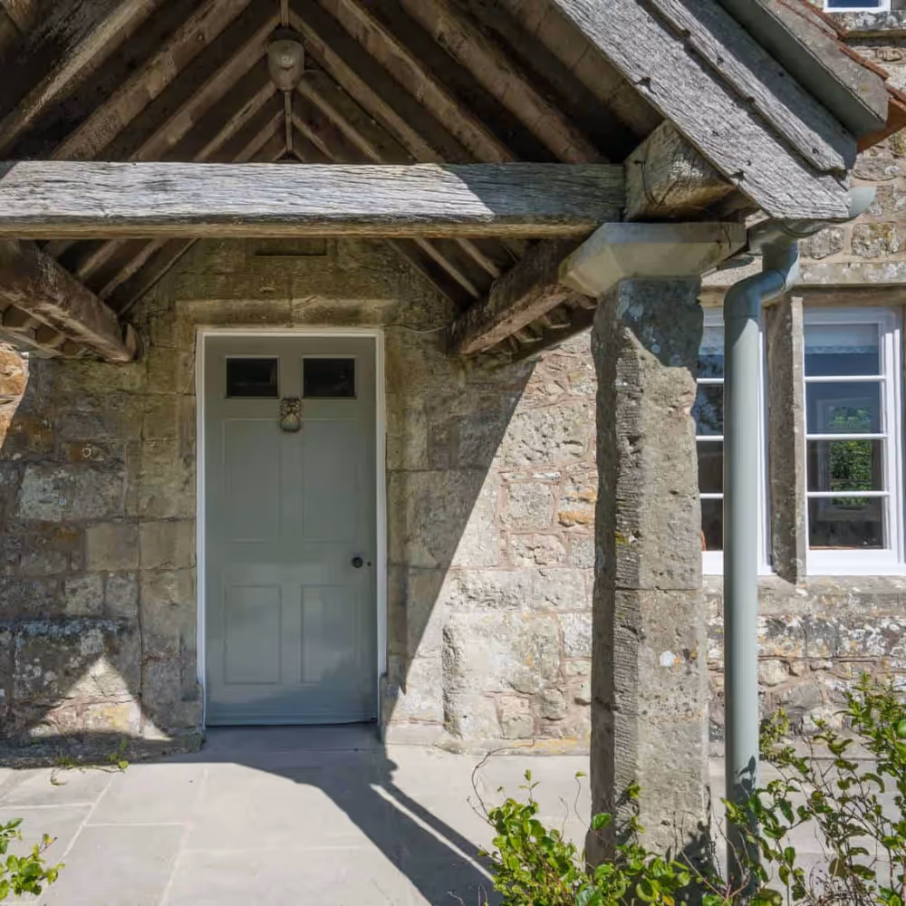 Entrance porch of an old stone farmhouse
