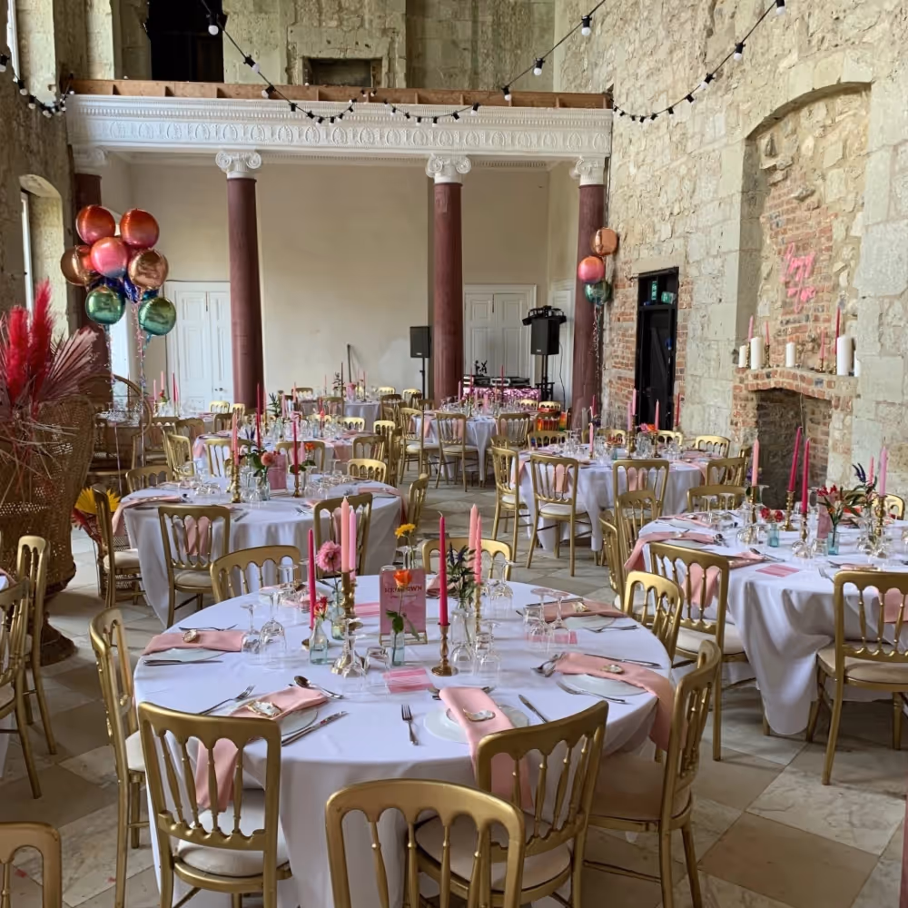 Interior of a ruined mansion set up for a wedding banquet