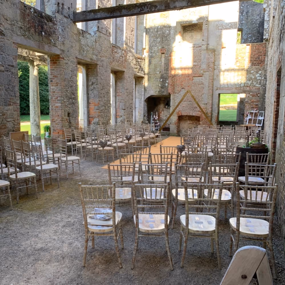 Interior of a ruined mansion set up for a wedding ceremony