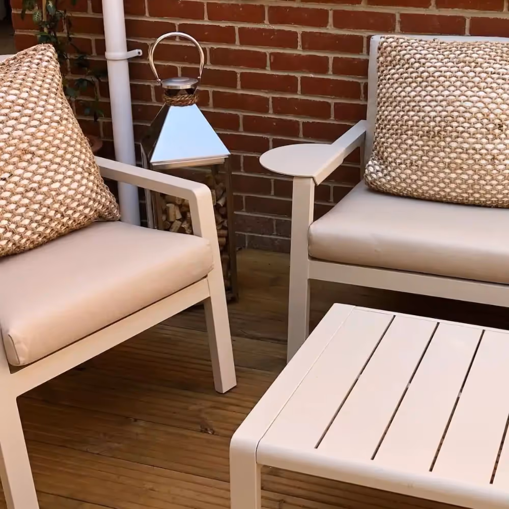 An outdoor space with modern armchairs