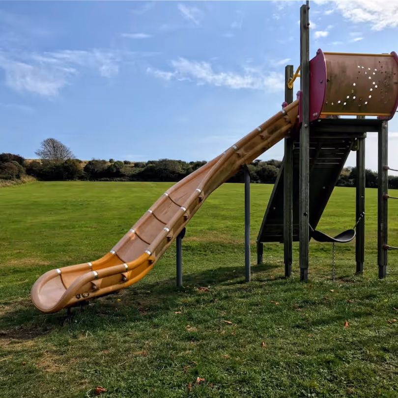 A twisty slide in a kids playground