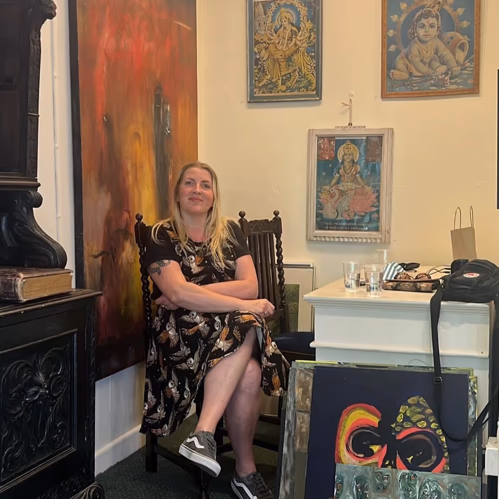 A lady sitting in an antiques shop