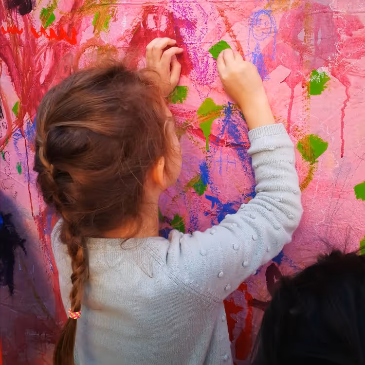 A child doing a colourful painting