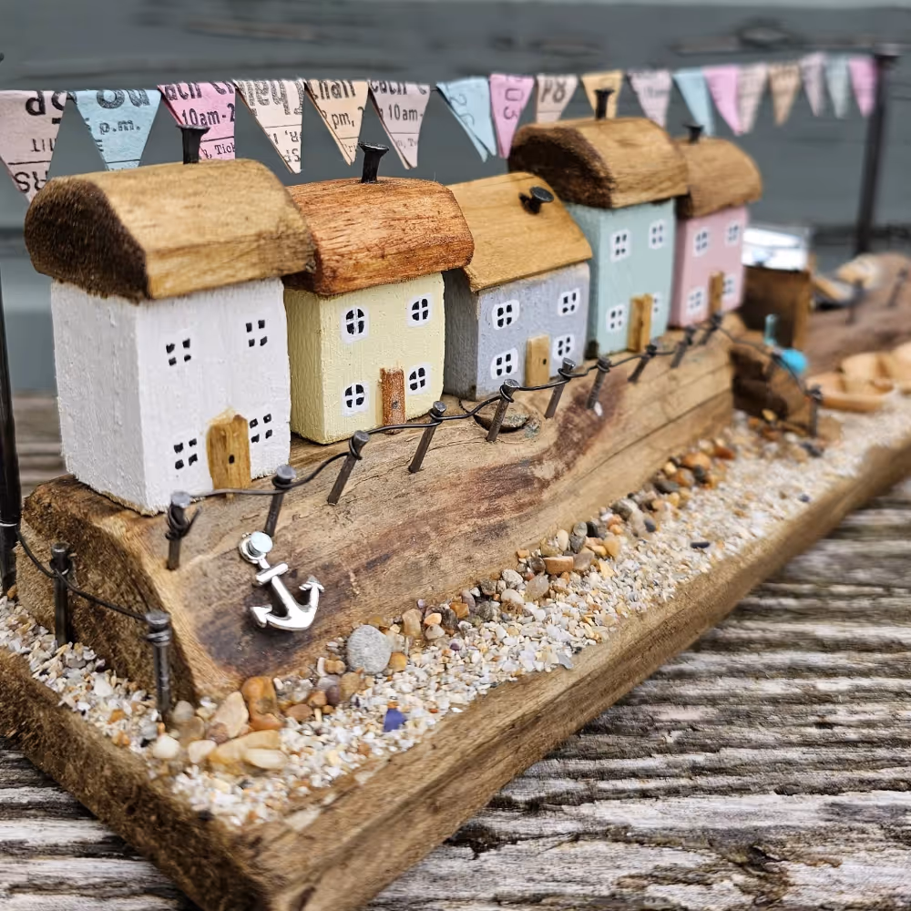 A handmade street of driftwood cottages