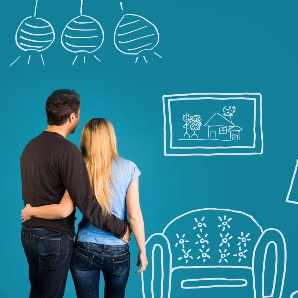 A man and a woman stood in front of a turquoise home themed graphic