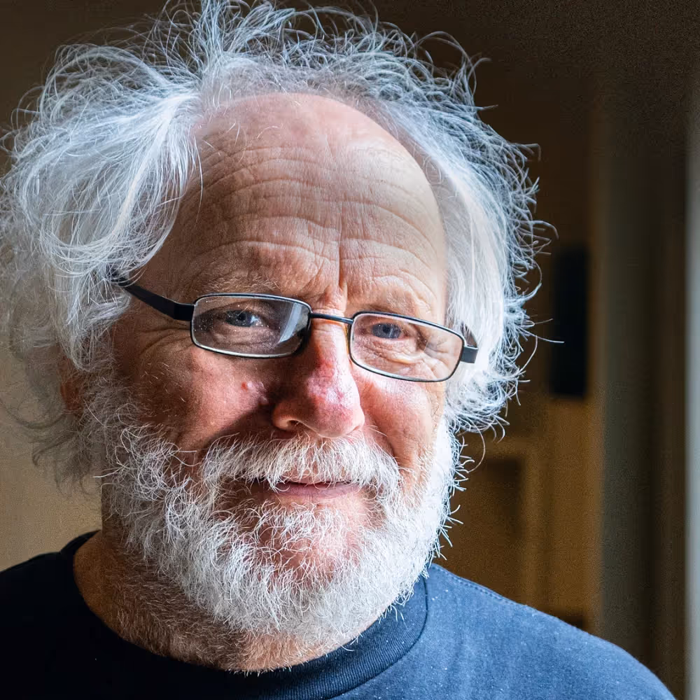 A man with grey hair and beard