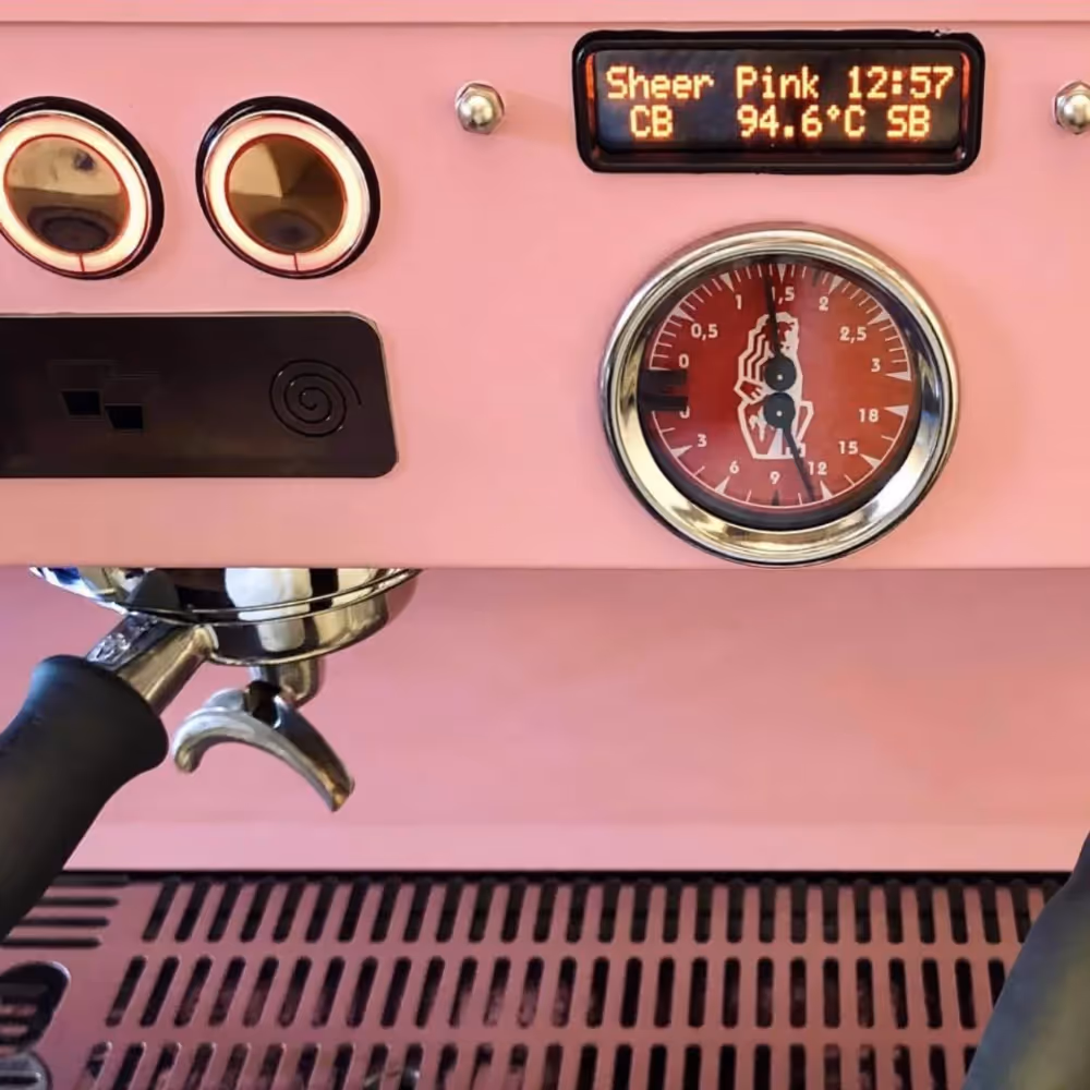 A pink commercial coffee machine