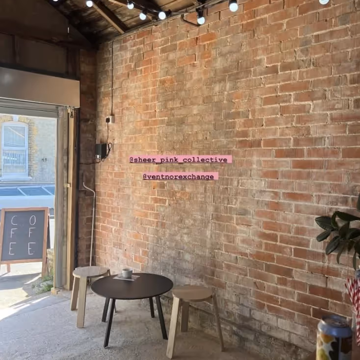 A coffee shop with bare brick walls