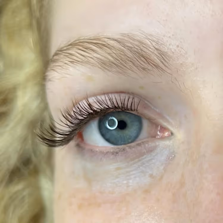 A lady post false eyelash application