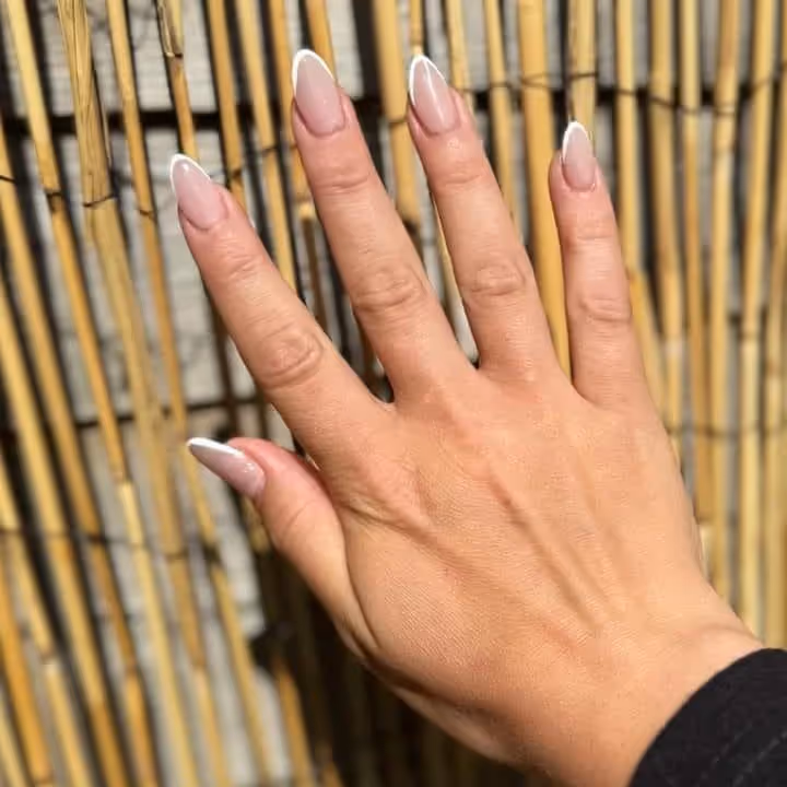 A hand with a French manicure