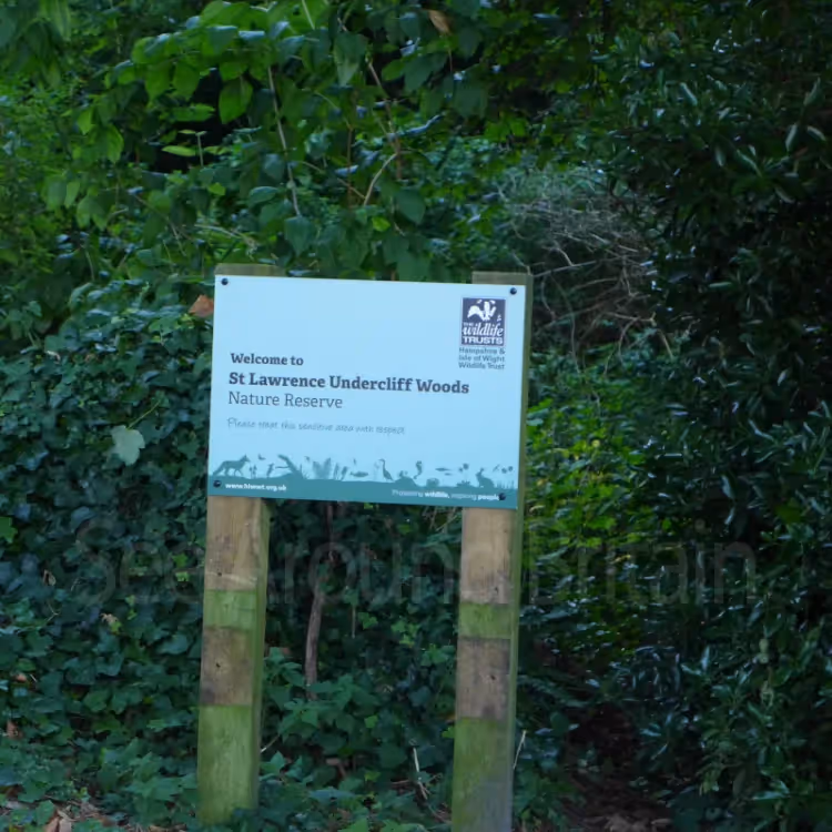 A sign for a woodland nature reserve