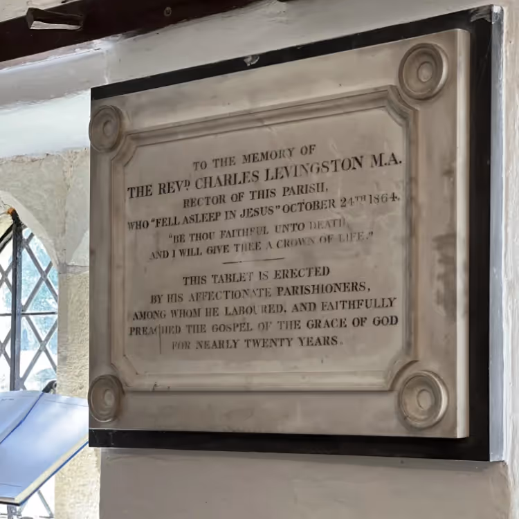 An inscription on a marble plaque in a church