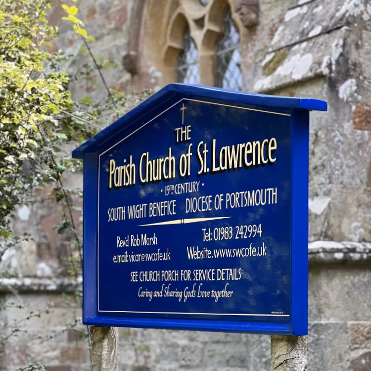 A blue sign outside a parish church