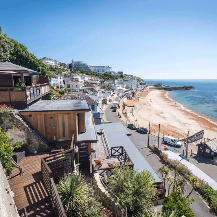 A wooden cabin looking down the beach