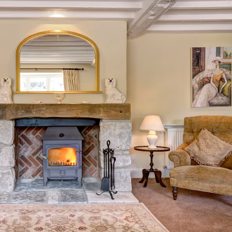A cosy farmhouse living room with real fire
