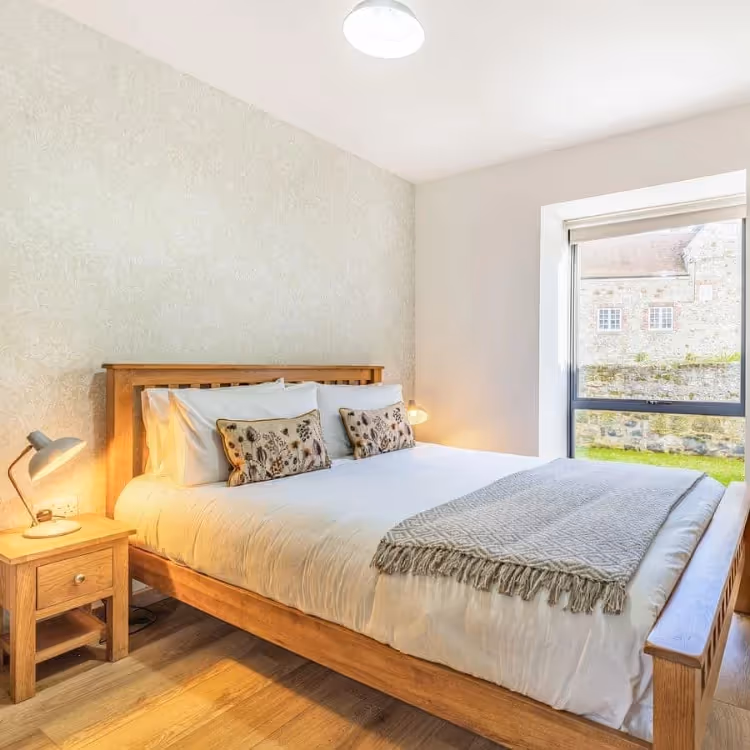 A bedroom with a modern oak interior