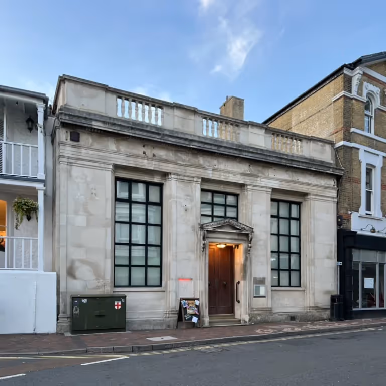An old bank building in a high street