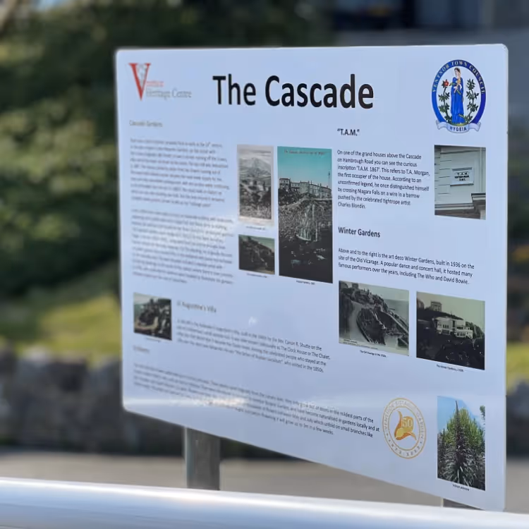 A sign with information about a town gardens