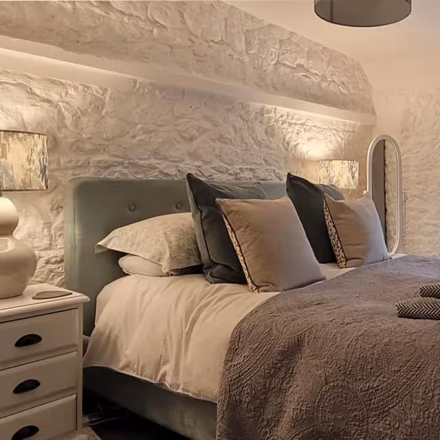 A bedroom in a stone cottage