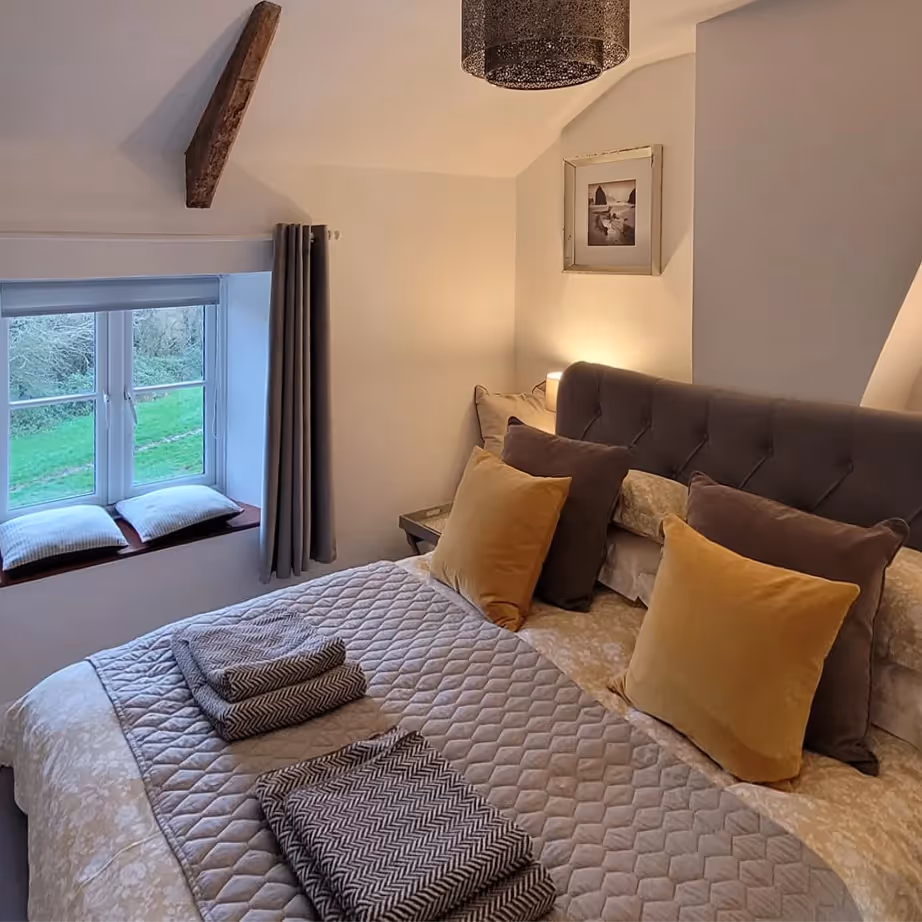 A bedroom in a stone cottage