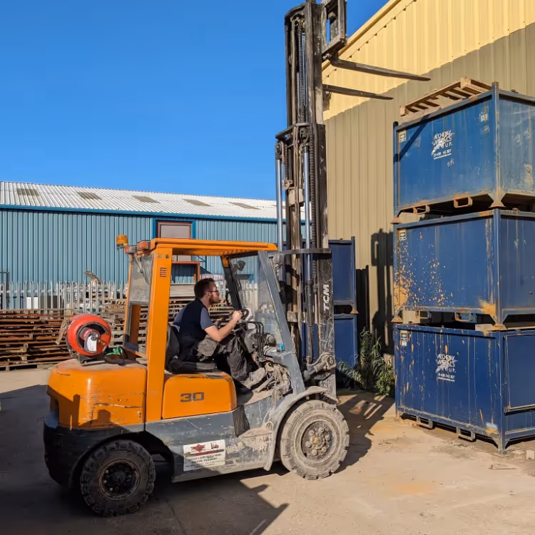 A man operating a forklift truck