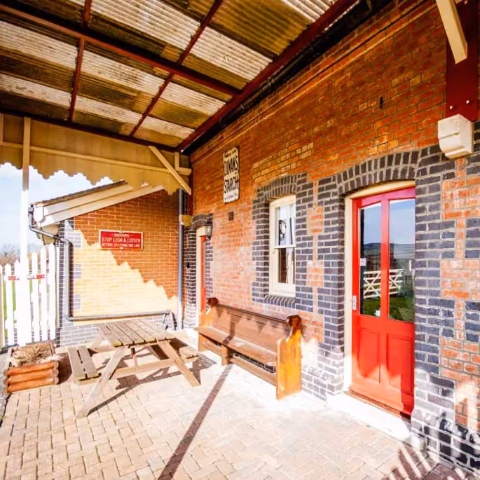 Outside the entrance of a disused railway station