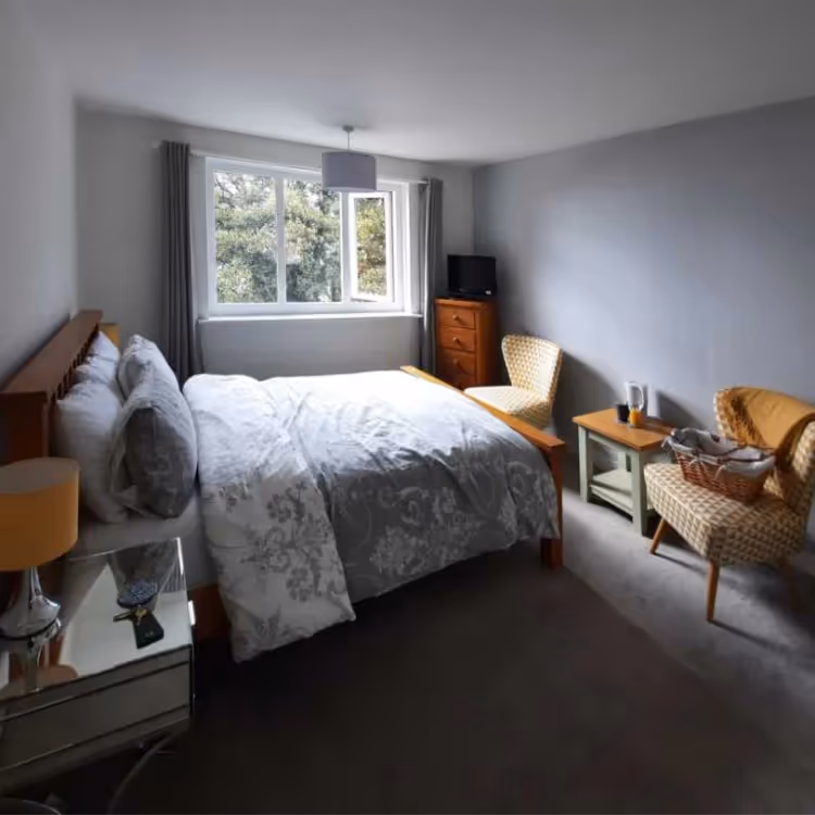 A hotel bedroom with modern furniture