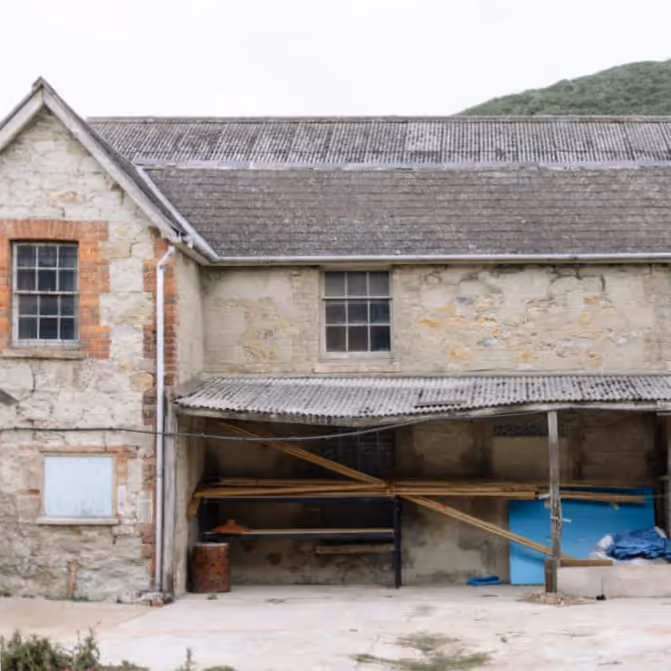 The exterior of an old builders workshop building