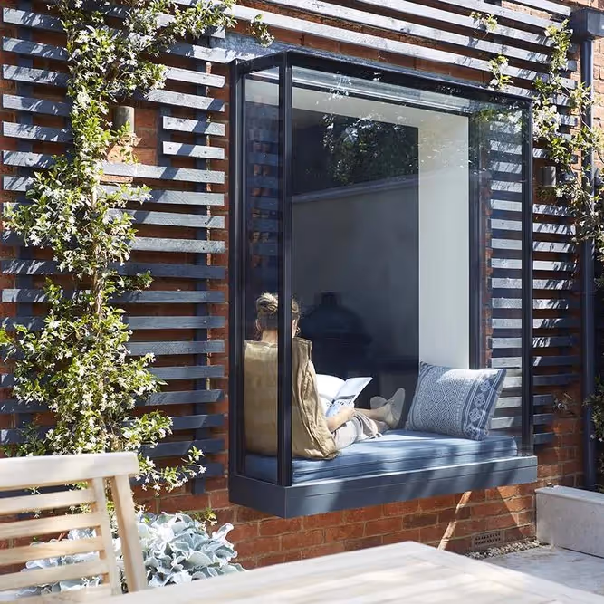 A seat inside a modern bay window