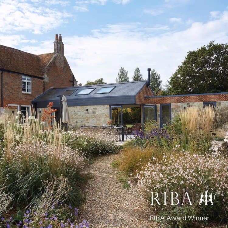 A modern architect design house in a wild meadow garden