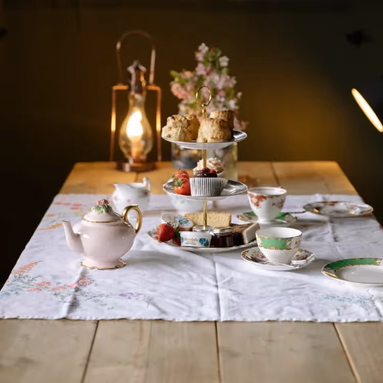 A pine table set for afternoon tea