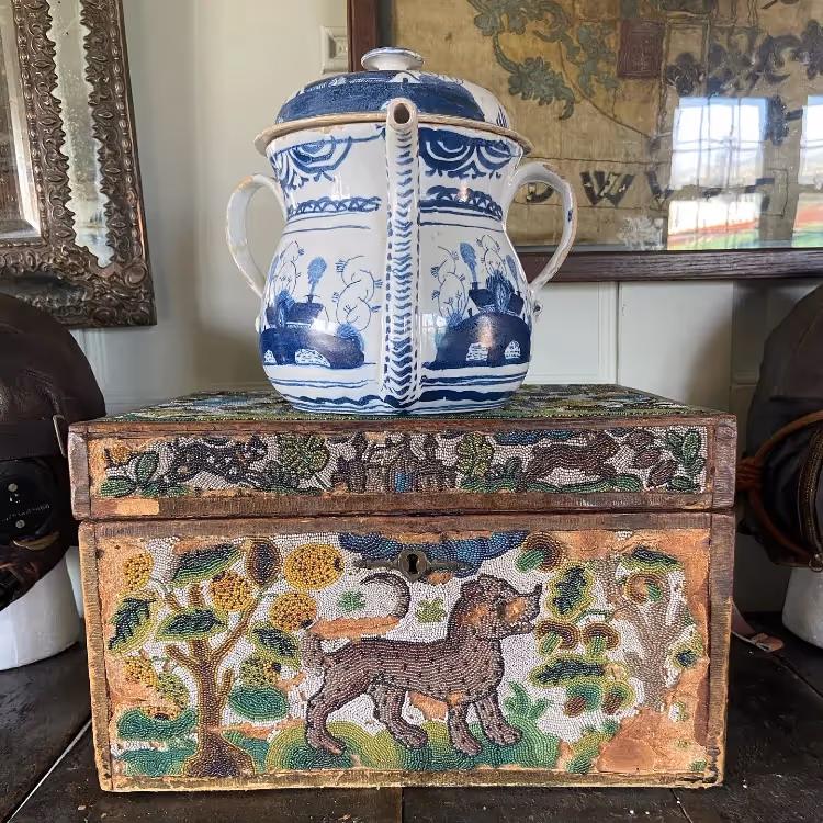 A delft china teapot and an antique beaded box