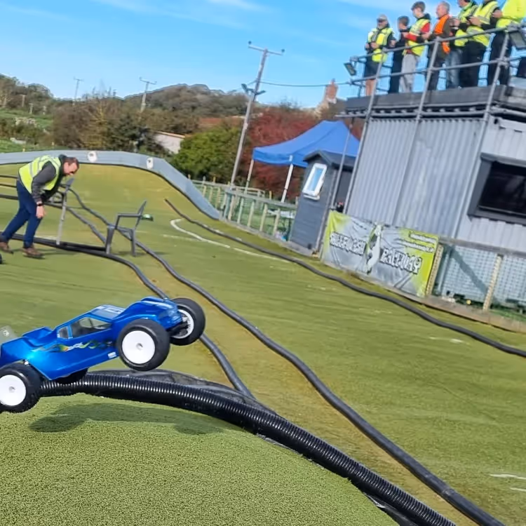 A remote control car in the air mid race