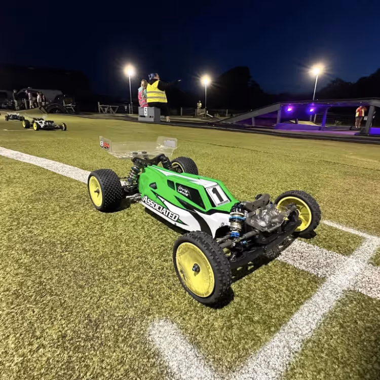 A remote control car being raced at night