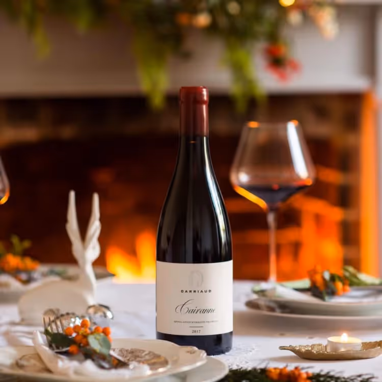 A bottle of red wine on a Christmas dining table