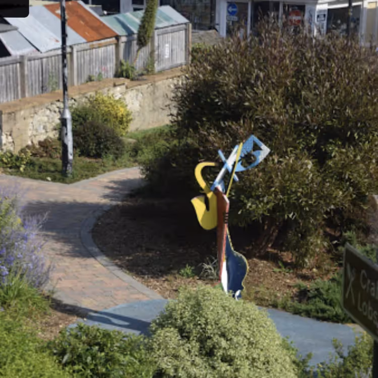 A metal sculpture in a town garden