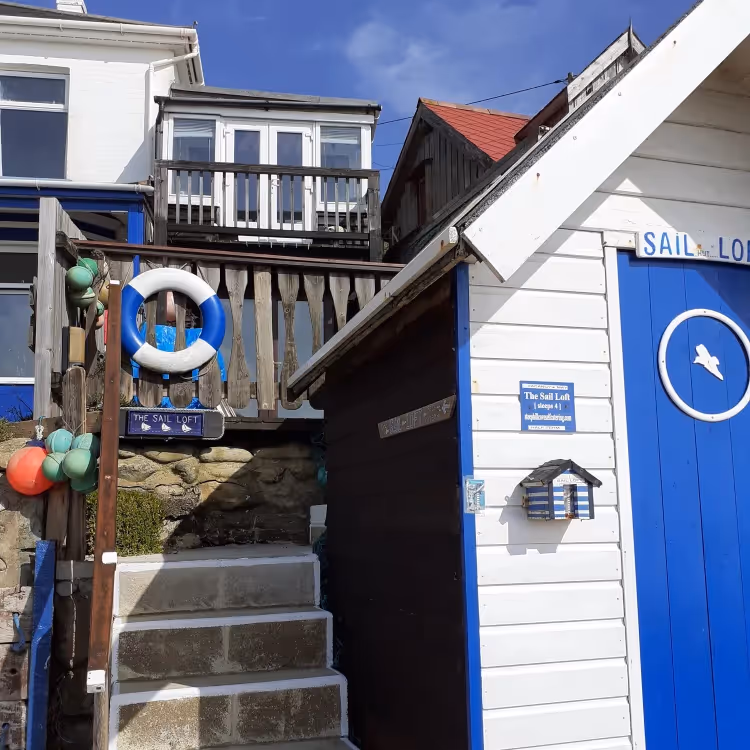 Steps leading to a property behind a beach hut