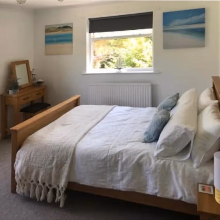 A modern bedroom with a coastal theme
