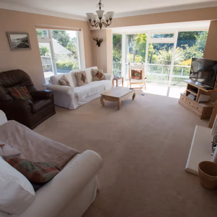 A spacious living room with large windows
